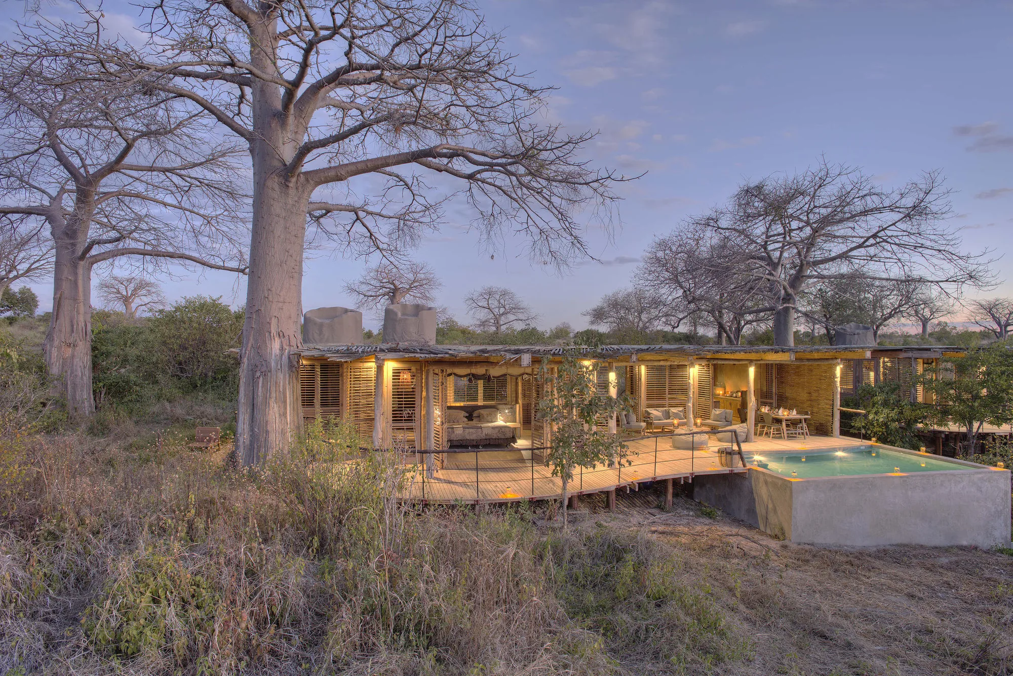 Private house with a swimming pool among baobab trees